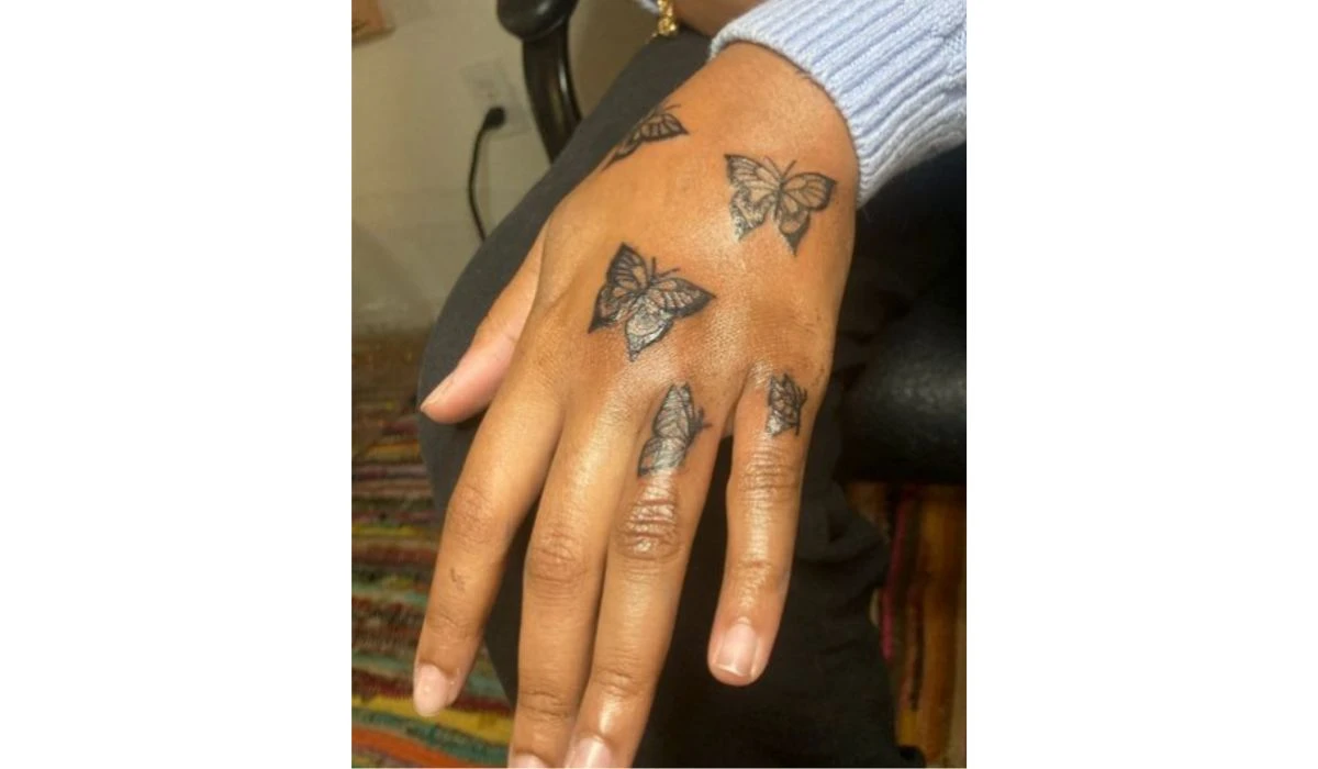 Butterfly finger tattoo