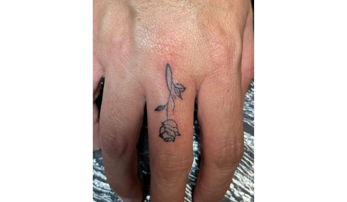 rose finger tattoo