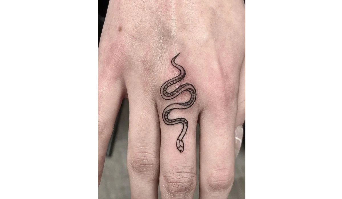 Snake finger tattoo