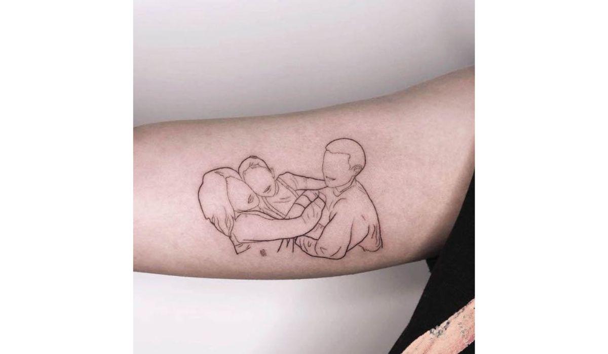 Masha S • Fine Line Tattoo • NYC | “Mother kissing her child” with client's  son initials - in my signature fine, tangled line tattoo 3RL & 5RL Booking:  Link in Bio... | Instagram