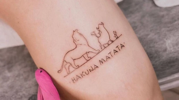 Meaningful mother-son tattoo symbols Hakuna matata