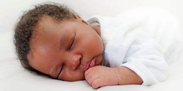 Newborn Grunting and Squirming While Sleeping