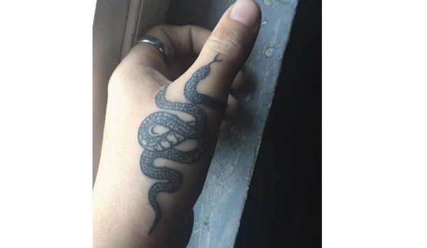 Snake finger tattoo