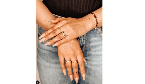 Middle finger tattoo