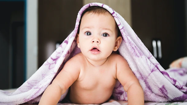 When do babies roll over?