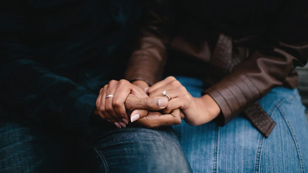 Couple holding hands