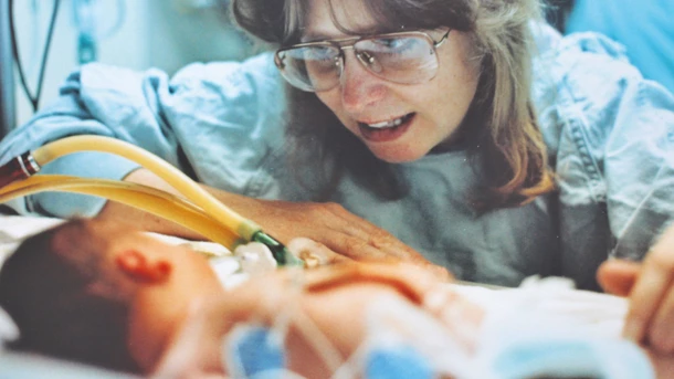 Woman visiting baby in the NICU