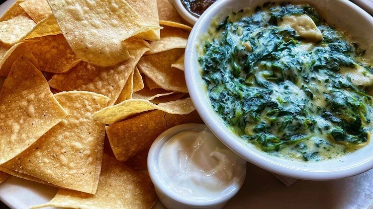 Spinach dip with pumpkin tortilla chips - Halloween Food Ideas for Kids