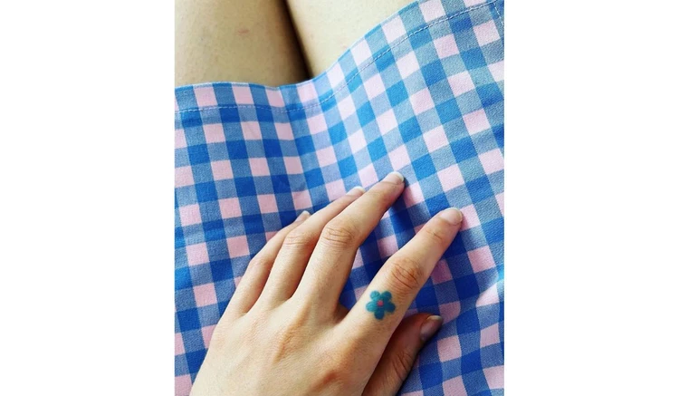Flower finger tattoo