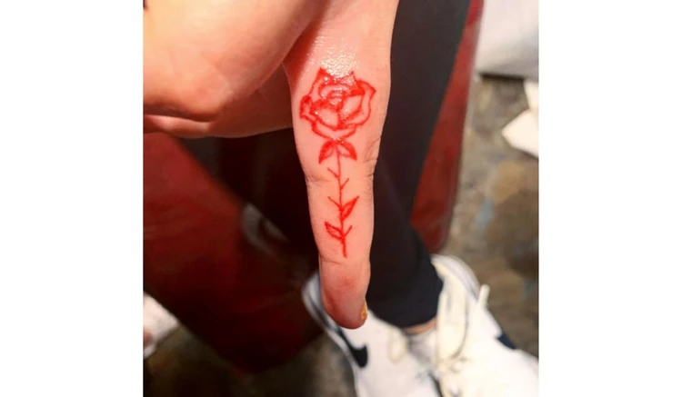 rose finger tattoo
