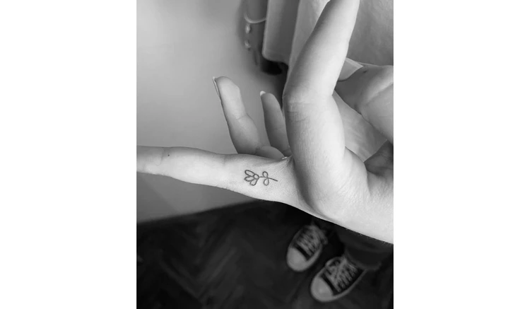 Flower finger tattoo