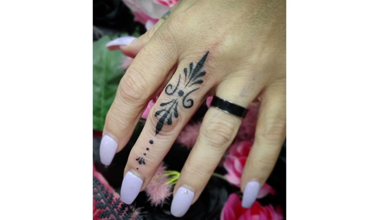 Middle finger tattoo