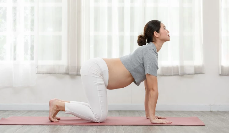 positions to relieve gas while pregnant