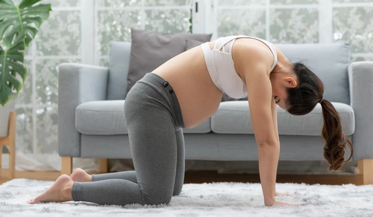 positions to relieve gas while pregnant