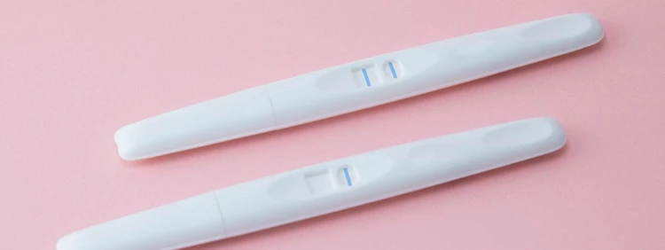 positive blue dye pregnancy test with two vertical lines
