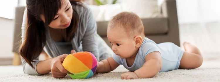 11 month old activities: ball-rolling
