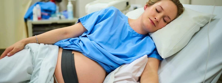 pregnant-woman-asleep-in-hospital