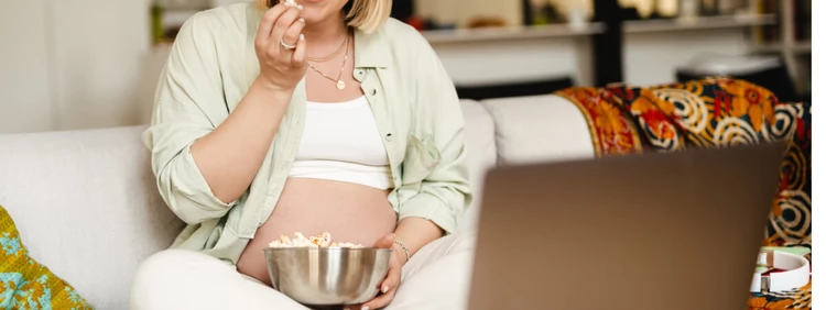 pregnant-woman-eating-popcorn